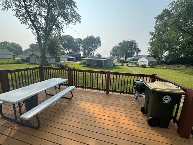 a view of wooden deck with a table and chairs