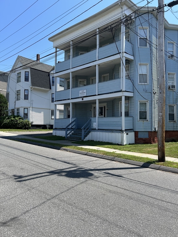 80 Cochran Street, Unit 3L Chicopee, MA 01020 - Photo 2 of 8 a view of a house with a yard