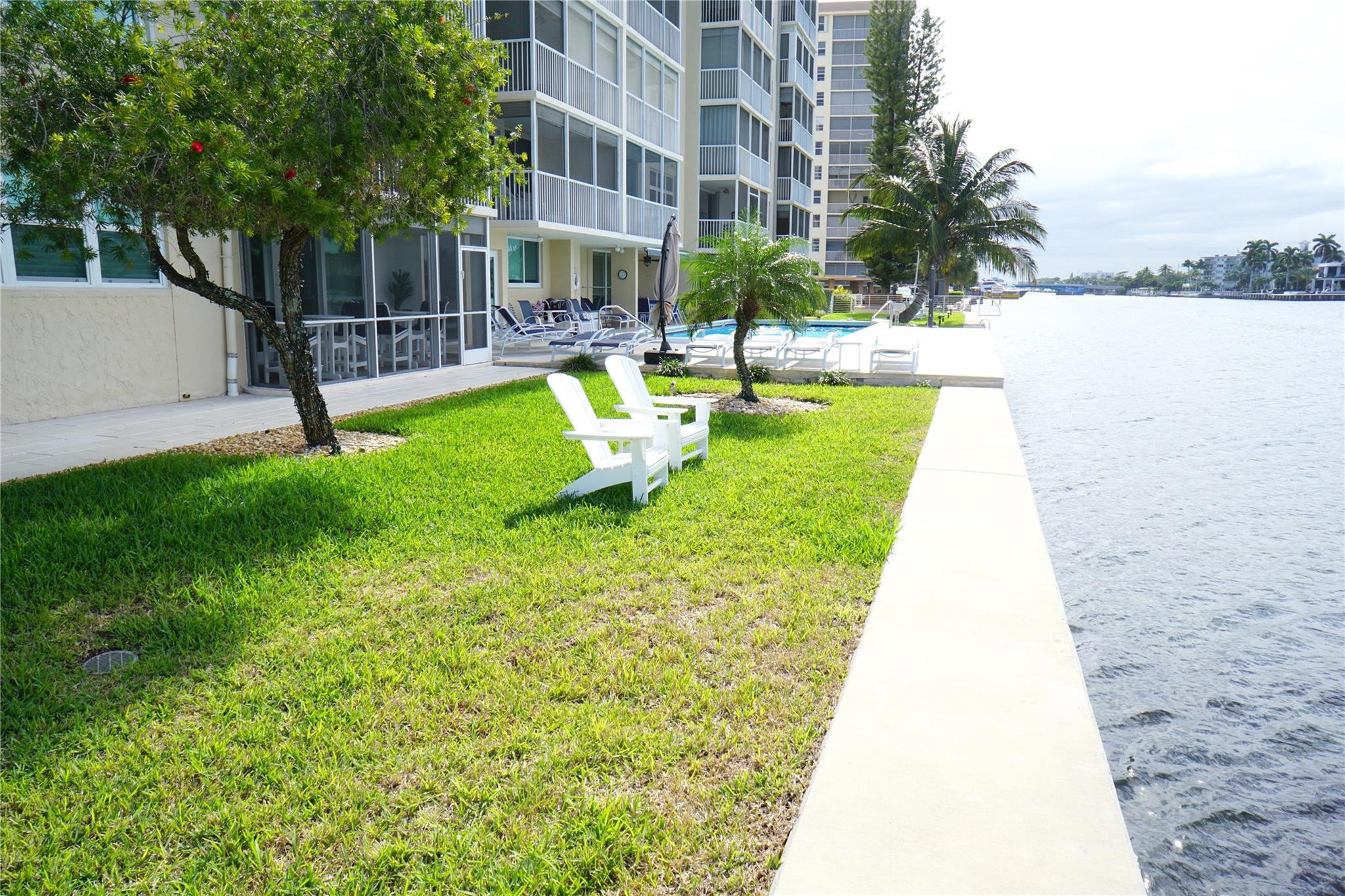 303 North Riverside Drive, Unit PH4 Pompano Beach, FL 33062 - Photo 50 of 52 a view of a swimming pool with a patio