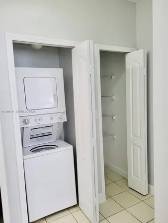 a view of a hallway with a room