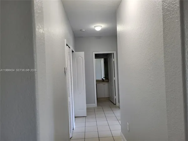 a view of a hallway with closet