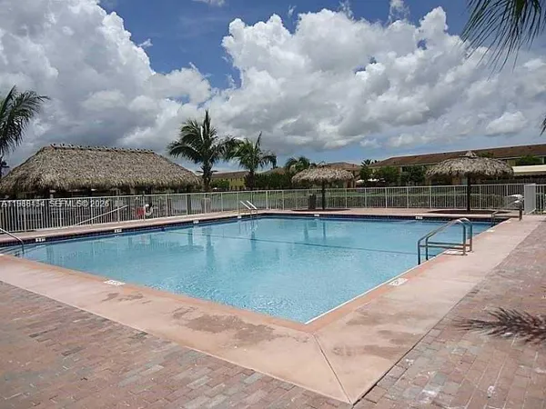 a view of a swimming pool with a lake view