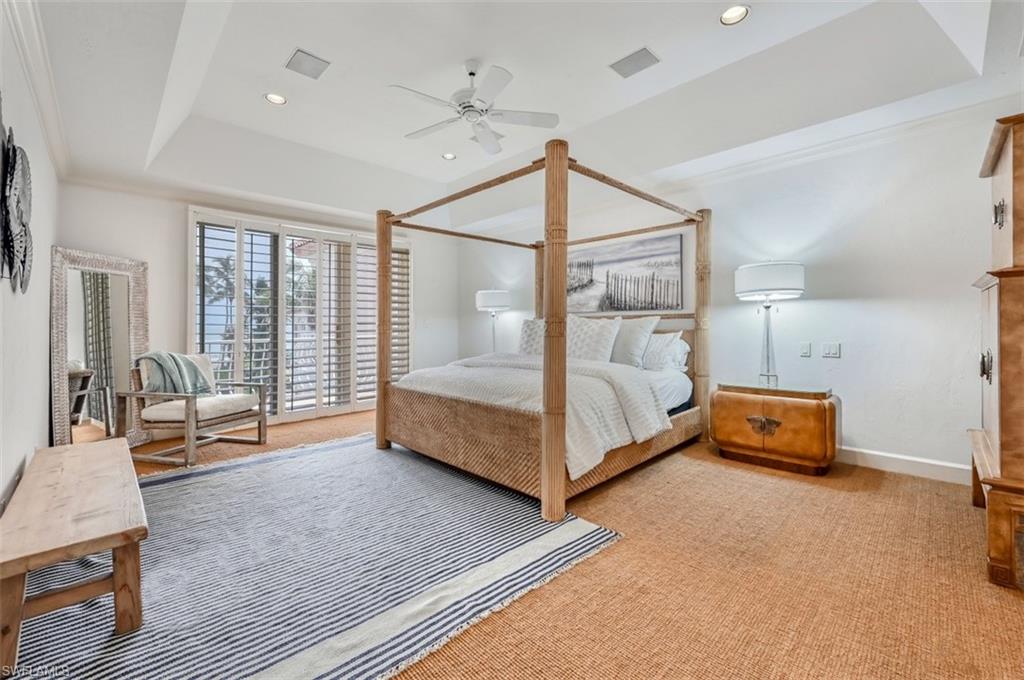 30 Casa Mar Lane Naples, FL 34103 - Photo 16 of 48 a bedroom with furniture and a window