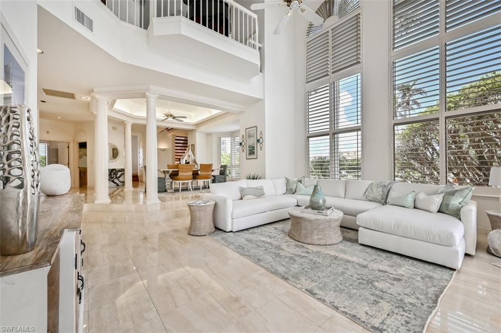 30 Casa Mar Lane Naples, FL 34103 - Photo 2 of 48 a living room with furniture and a large window