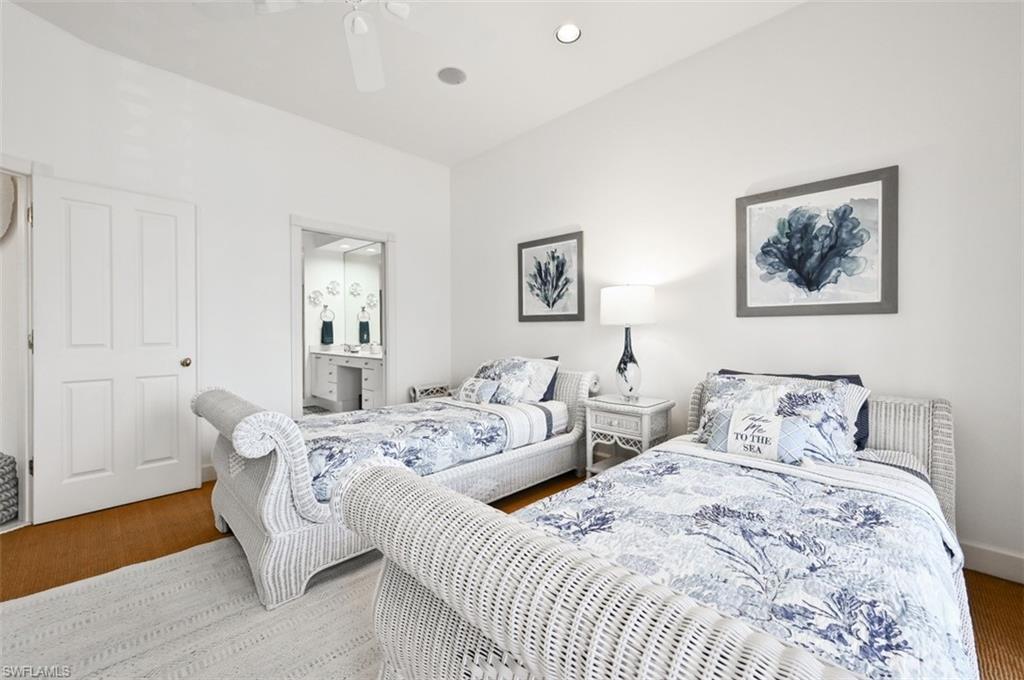 30 Casa Mar Lane Naples, FL 34103 - Photo 22 of 48 a bedroom with two beds and painting on the wall