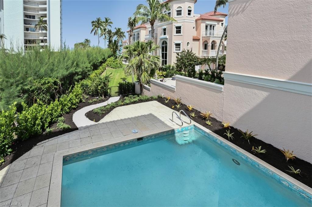 30 Casa Mar Lane Naples, FL 34103 - Photo 34 of 48 a view of a balcony with potted plants