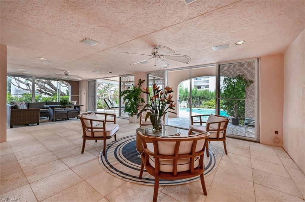 30 Casa Mar Lane Naples, FL 34103 - Photo 40 of 48 a view of a dining room with furniture window and outside view