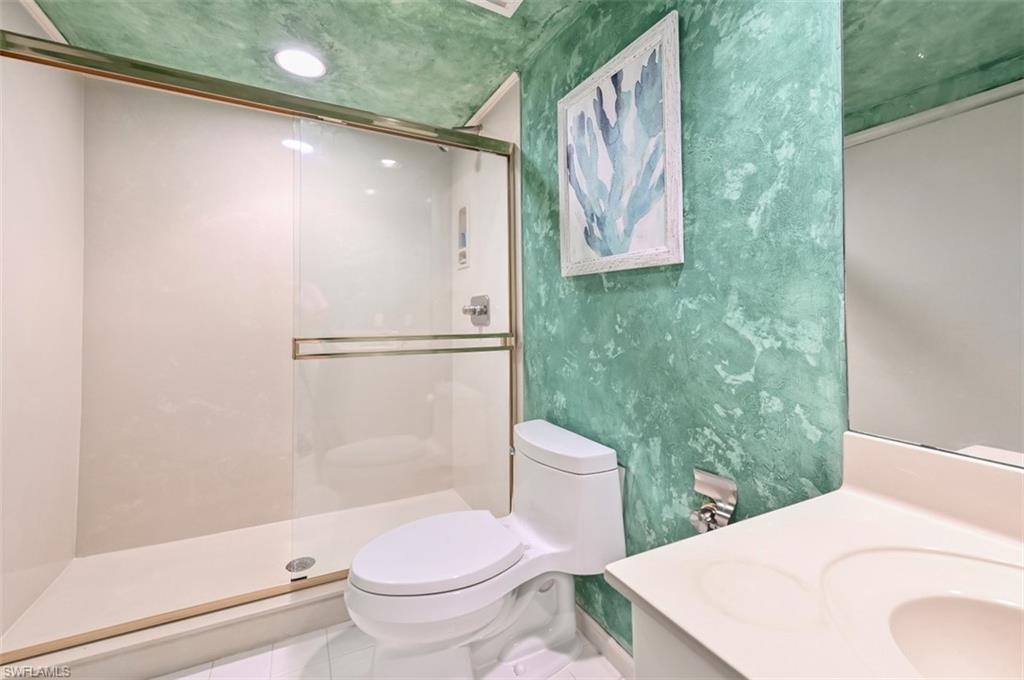 30 Casa Mar Lane Naples, FL 34103 - Photo 41 of 48 a bathroom with a toilet and a shower