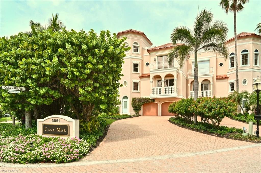 30 Casa Mar Lane Naples, FL 34103 - Photo 47 of 48 a front view of a house with a garden
