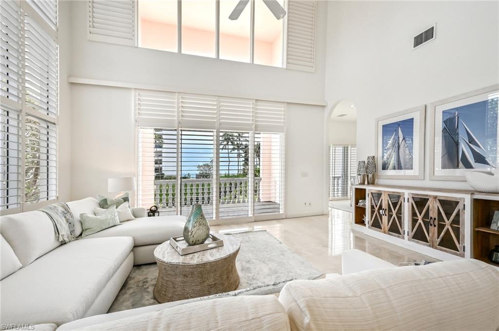 30 Casa Mar Lane Naples, FL 34103 - Photo 9 of 48 a living room with furniture and a large window