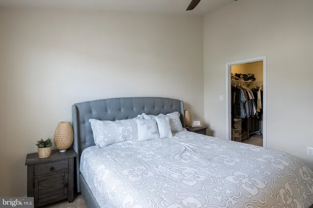 a bedroom with a bed and with furniture