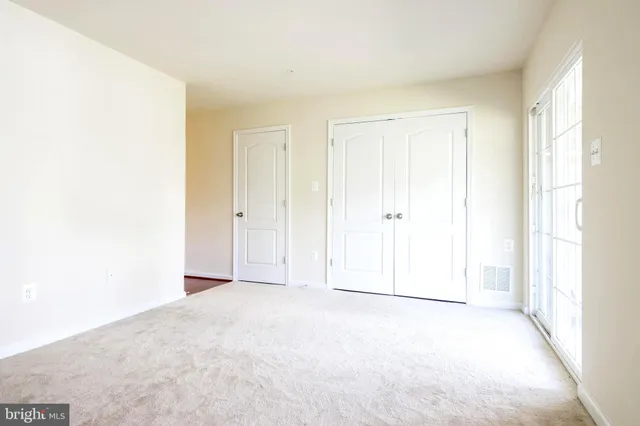 a bathroom with a double vanity sink and mirror