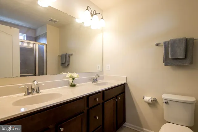 a bathroom with a glass shower door