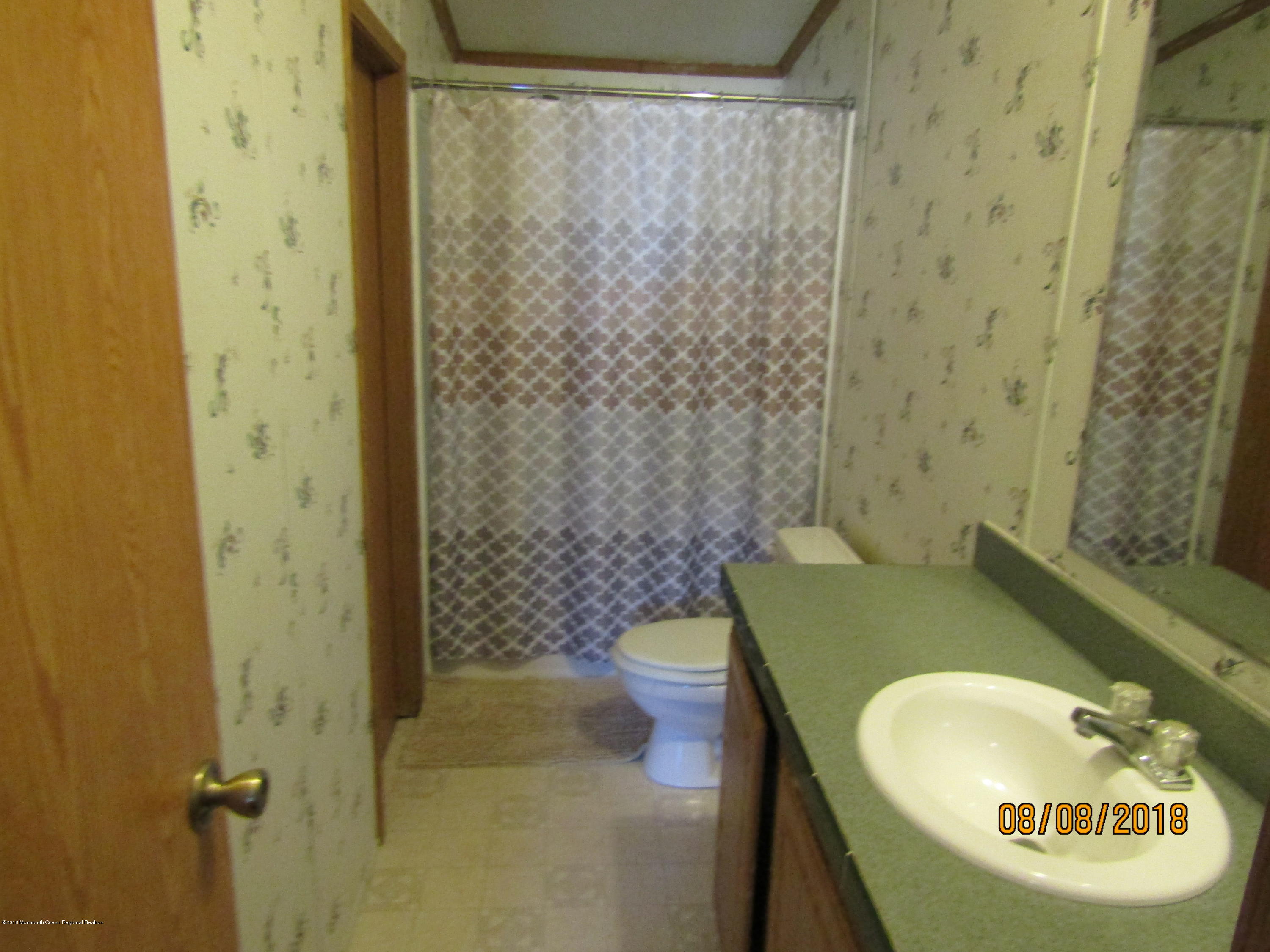 14 Kay Lane Howell, NJ 07731 - Photo 13 of 28 a bathroom with a sink and a toilet