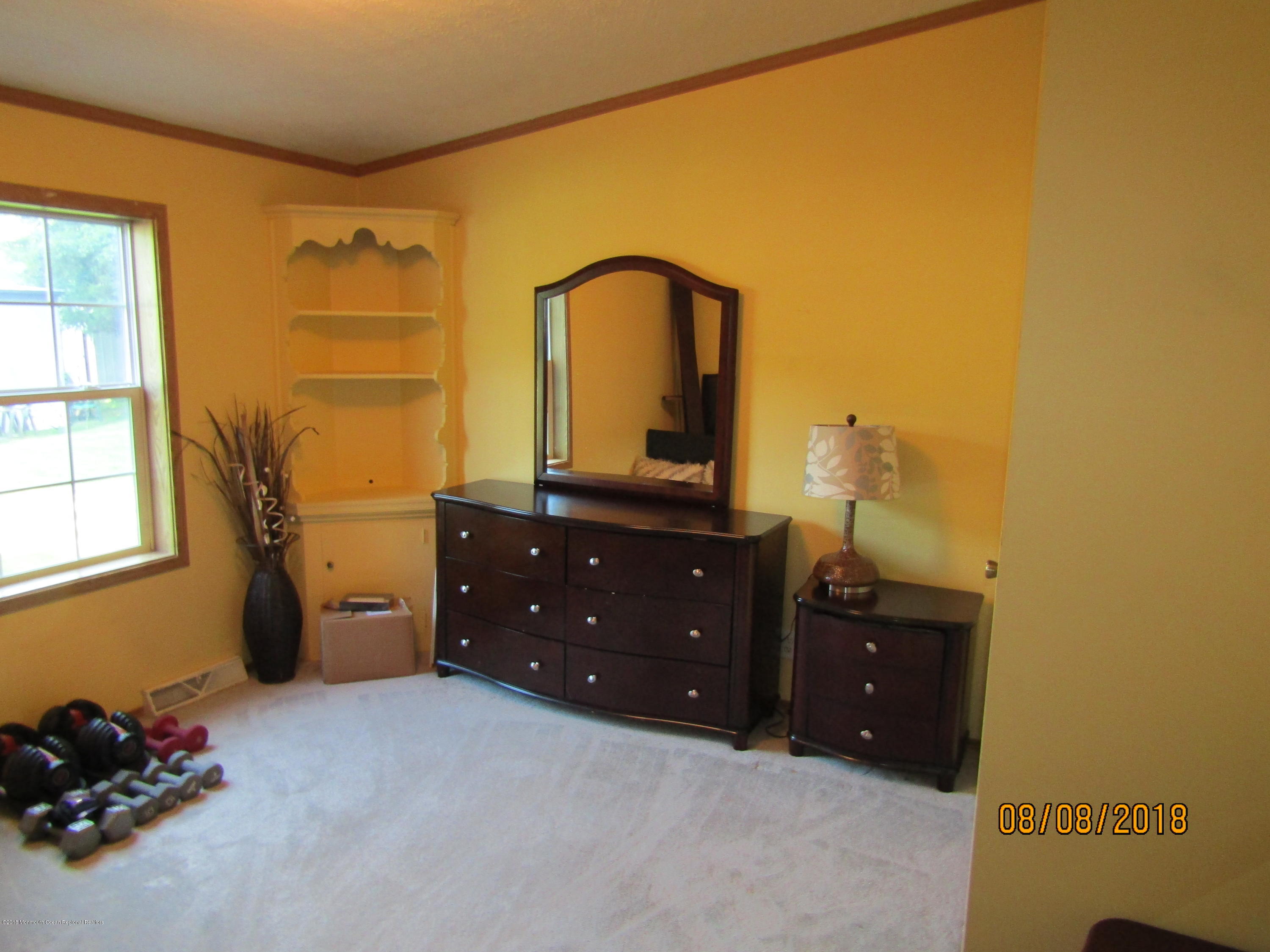 14 Kay Lane Howell, NJ 07731 - Photo 18 of 28 a bedroom with a bed and a dresser
