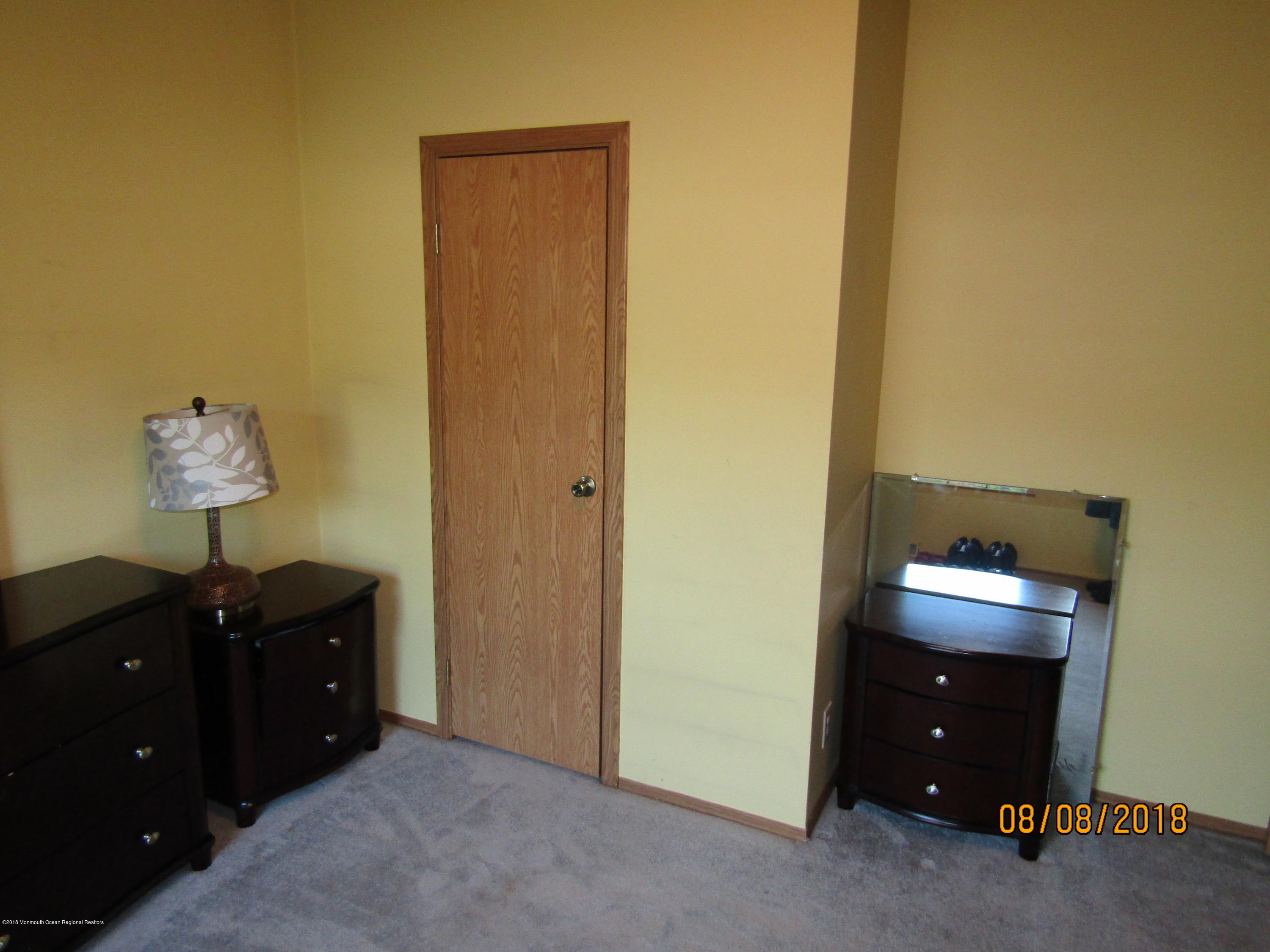 14 Kay Lane Howell, NJ 07731 - Photo 19 of 28 a room with a lamp and a dresser