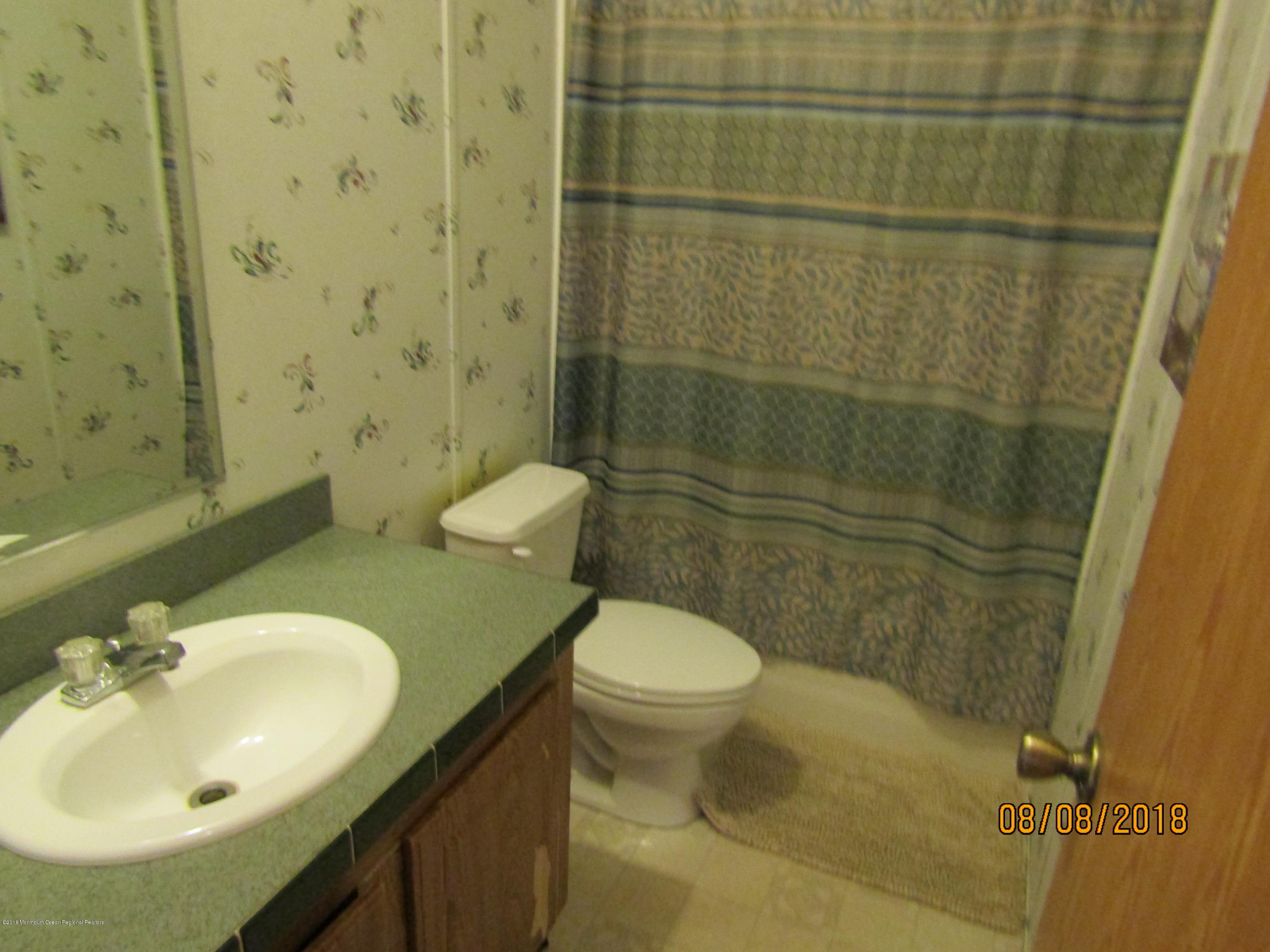 14 Kay Lane Howell, NJ 07731 - Photo 20 of 28 a bathroom with a sink toilet and shower