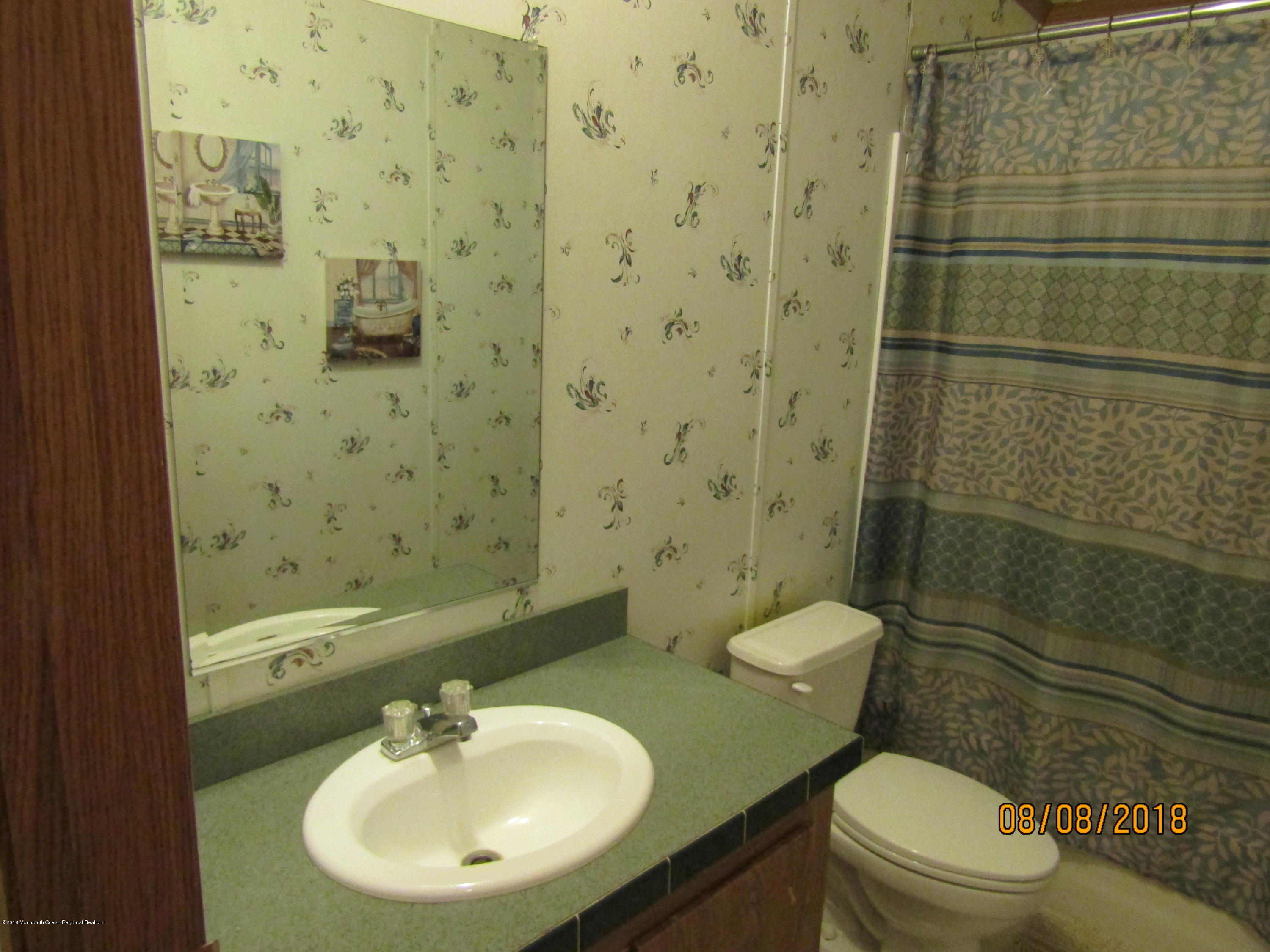 14 Kay Lane Howell, NJ 07731 - Photo 21 of 28 a bathroom with a sink toilet and shower