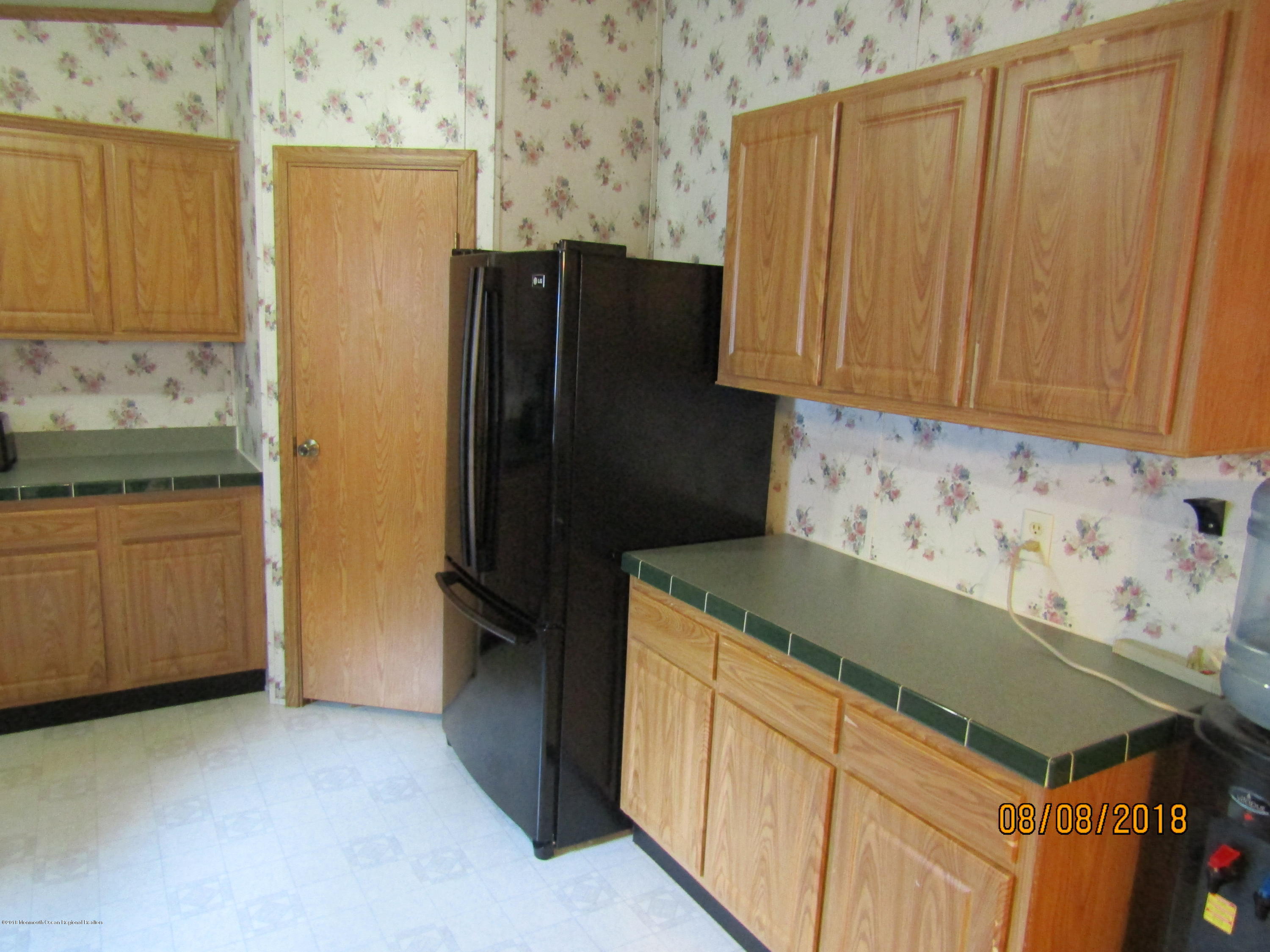 14 Kay Lane Howell, NJ 07731 - Photo 5 of 28 a kitchen with stainless steel appliances granite countertop a refrigerator and a stove