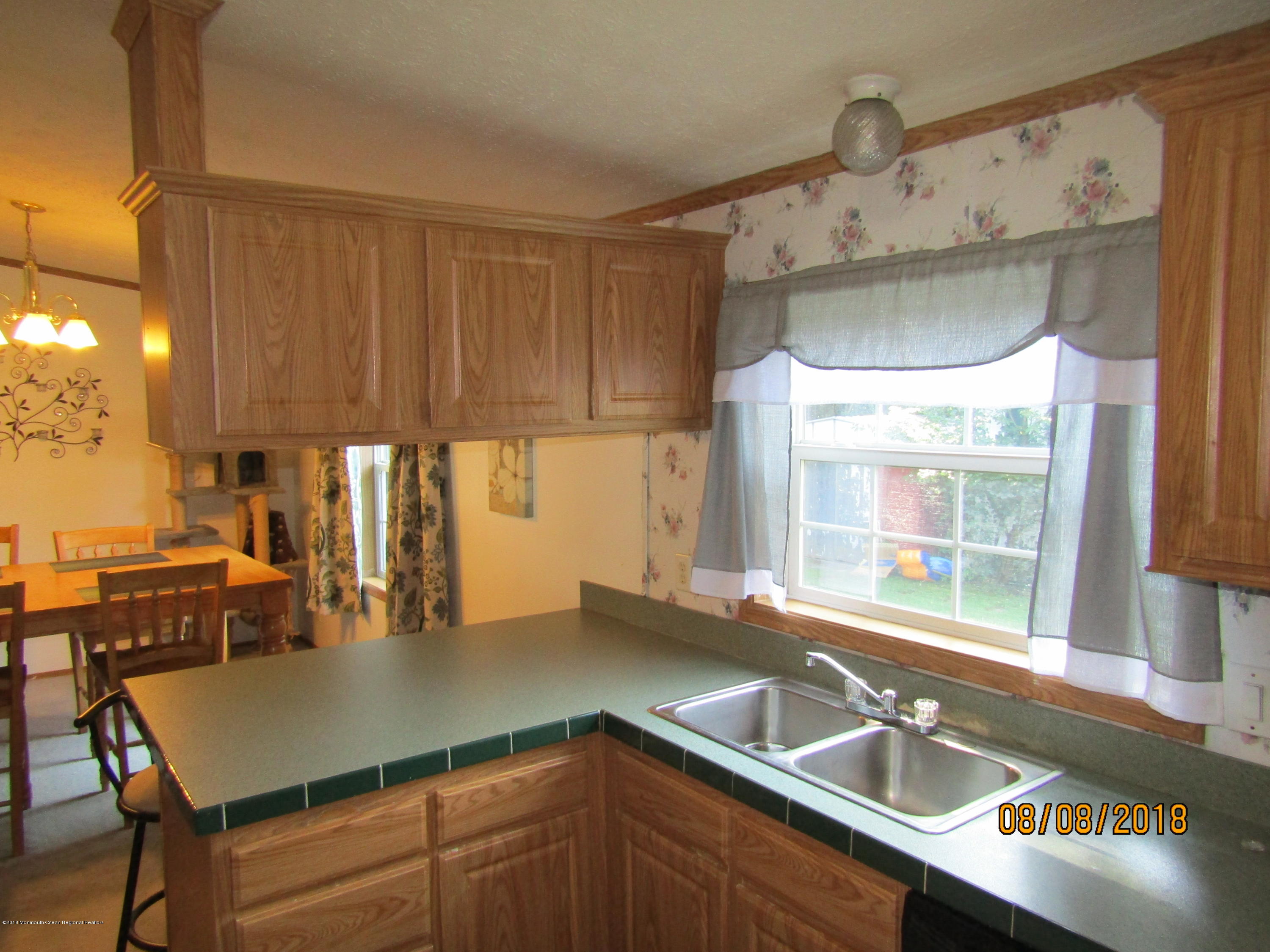 14 Kay Lane Howell, NJ 07731 - Photo 7 of 28 a kitchen with a sink a counter top space and cabinets