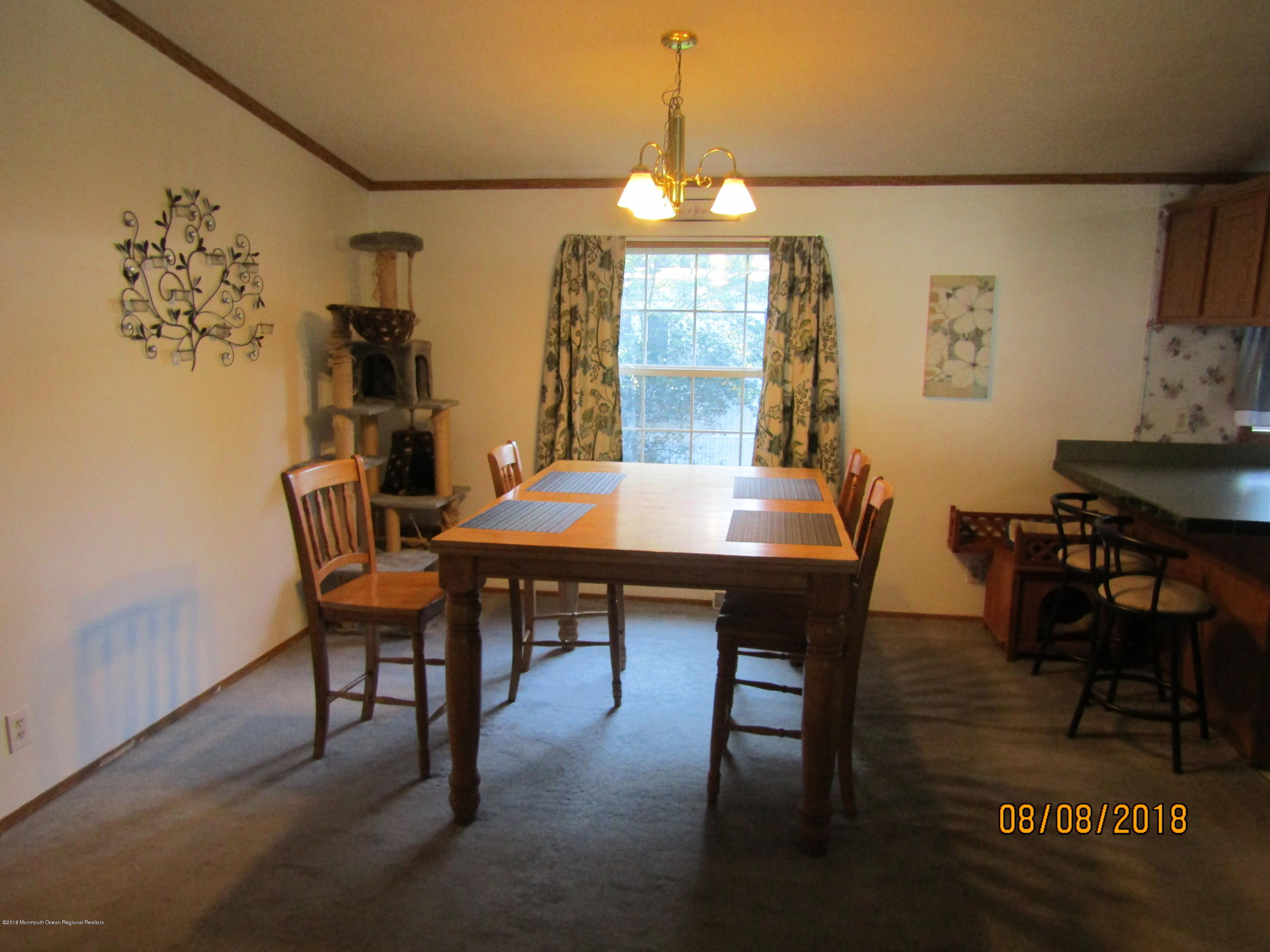 14 Kay Lane Howell, NJ 07731 - Photo 9 of 28 a view of a dining room with furniture and window