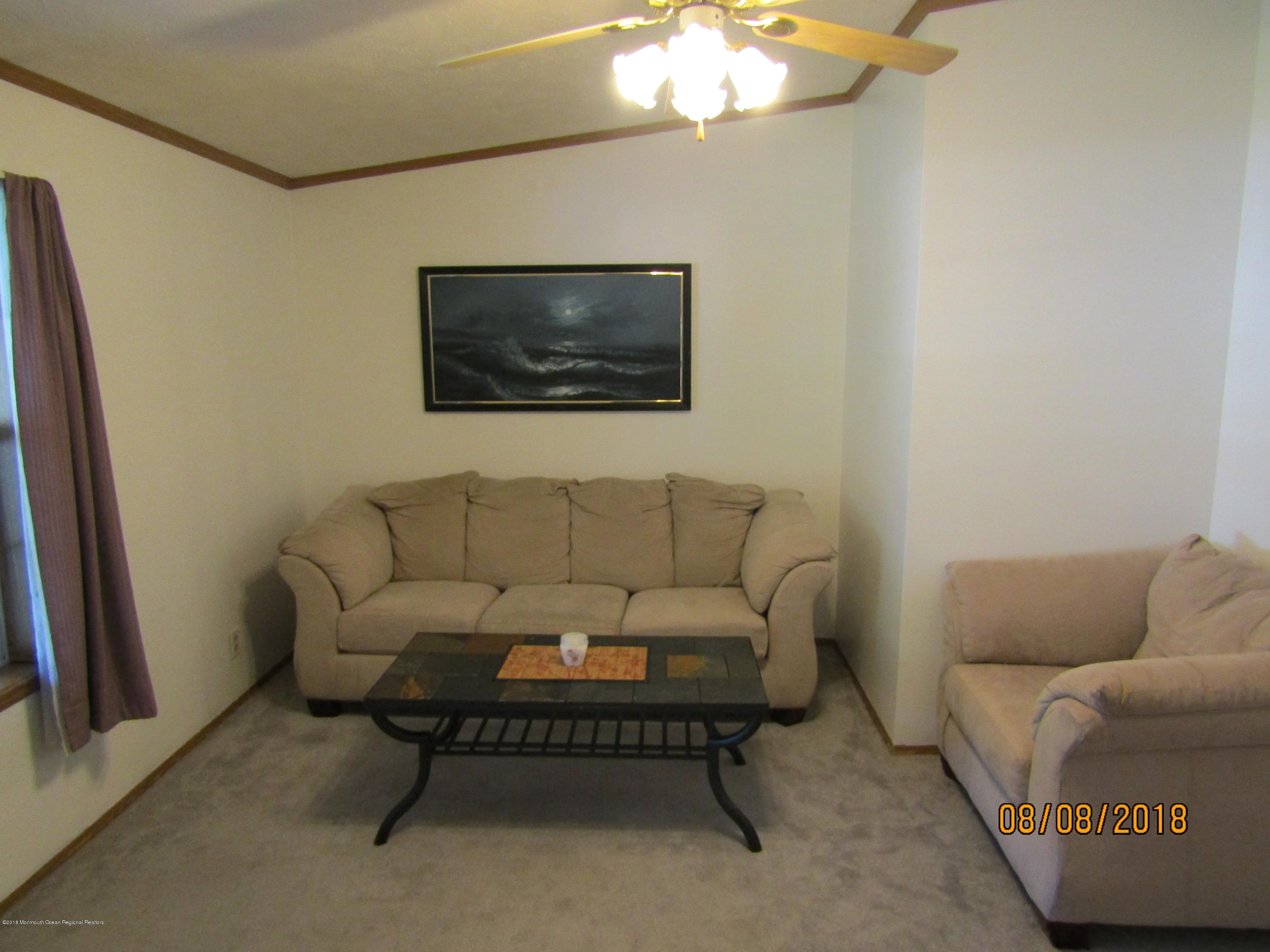 14 Kay Lane Howell, NJ 07731 - Photo 10 of 28 a living room with furniture and a flat screen tv