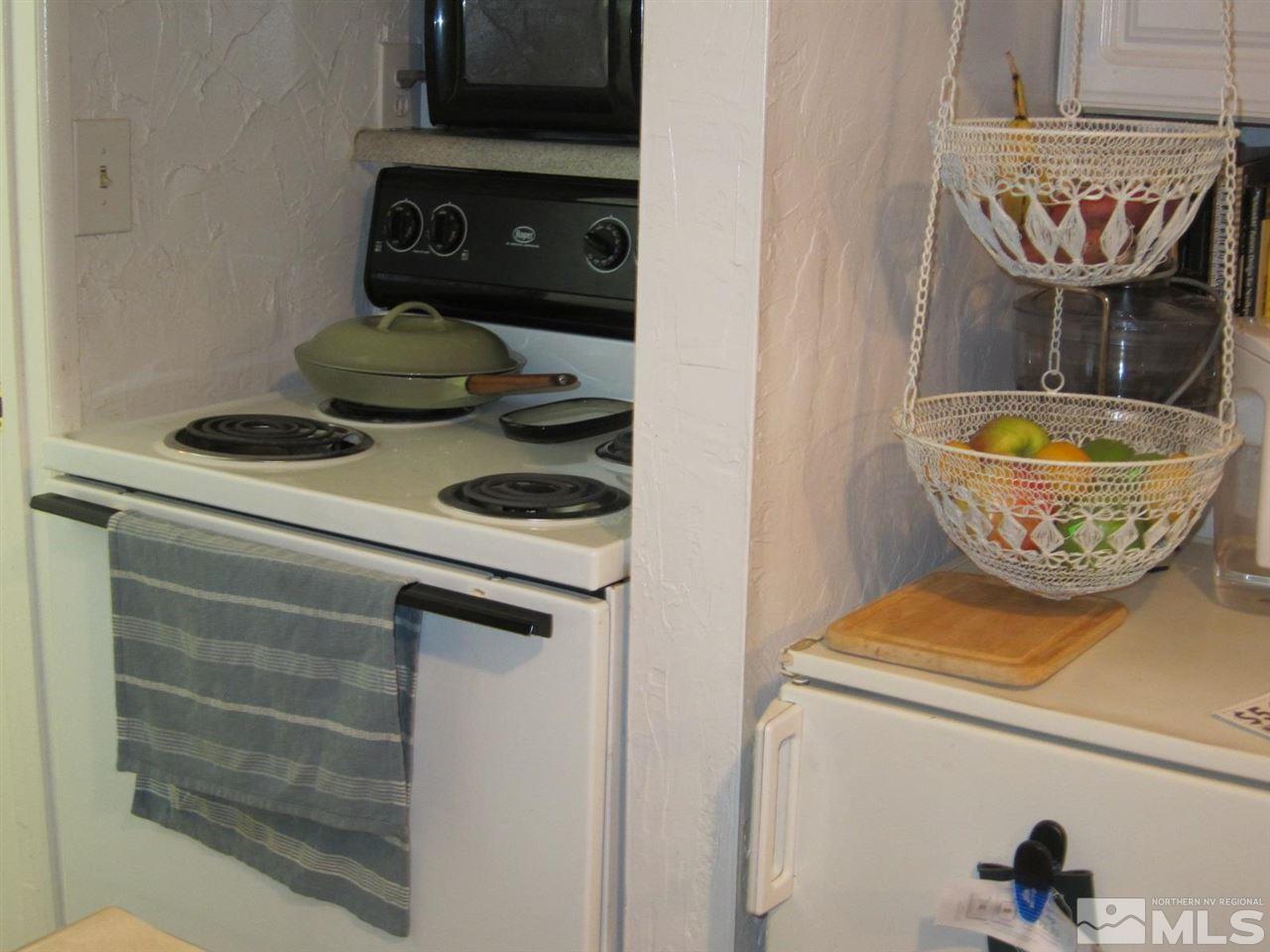 1931 Valley Road Reno, NV 89512 - Photo 16 of 20 a kitchen with a stove and a cabinet