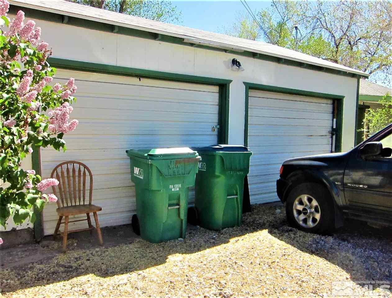 1931 Valley Road Reno, NV 89512 - Photo 7 of 20 a view of a backyard with chairs and a garage