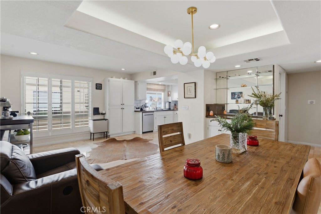 5340 Las Virgenes Road, Unit 11 Calabasas, CA 91302 - Photo 14 of 46 a living room with furniture kitchen view and a chandelier