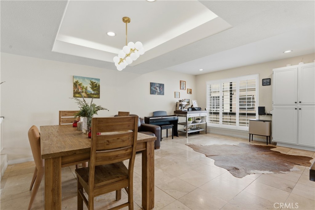5340 Las Virgenes Road, Unit 11 Calabasas, CA 91302 - Photo 15 of 46 a view of a dining room with furniture and a chandelier
