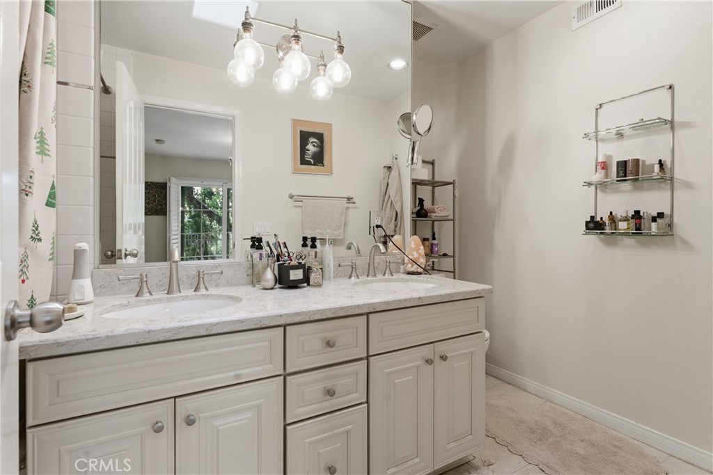 5340 Las Virgenes Road, Unit 11 Calabasas, CA 91302 - Photo 23 of 46 a bathroom with a sink and a mirror