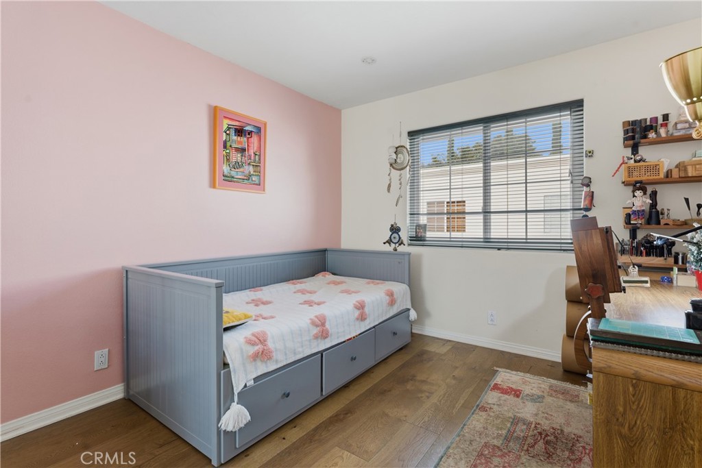 5340 Las Virgenes Road, Unit 11 Calabasas, CA 91302 - Photo 25 of 46 a bedroom with a bed and a window