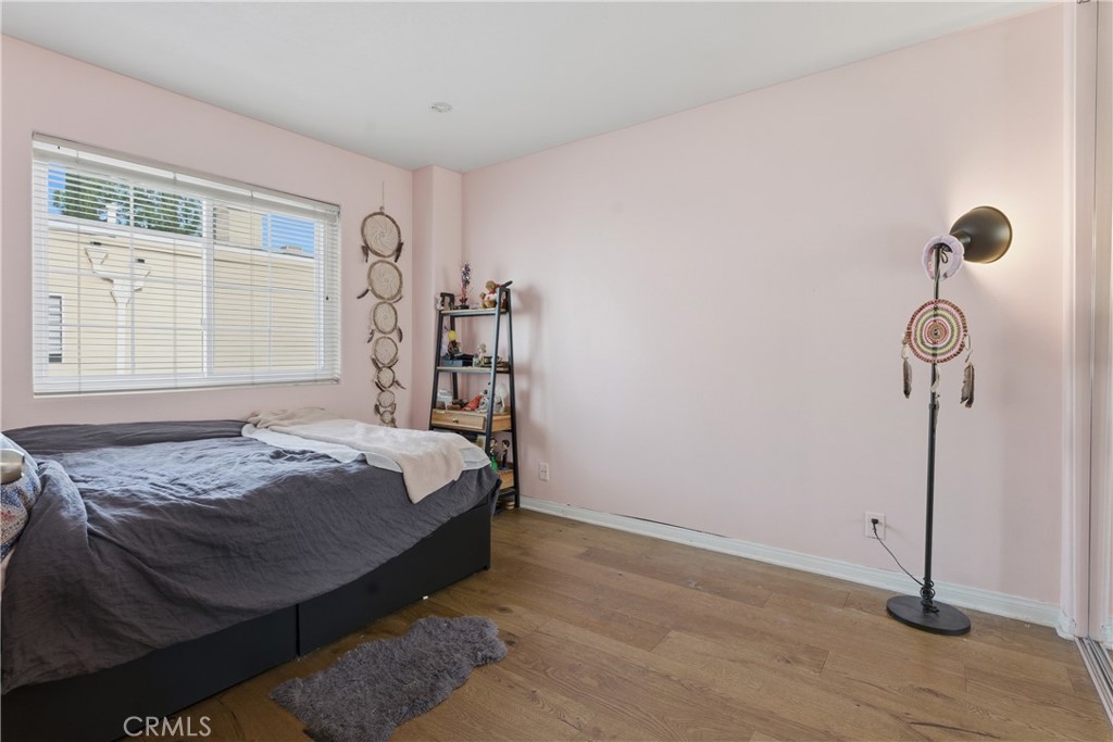 5340 Las Virgenes Road, Unit 11 Calabasas, CA 91302 - Photo 27 of 46 a bed sitting in a bedroom next to a window