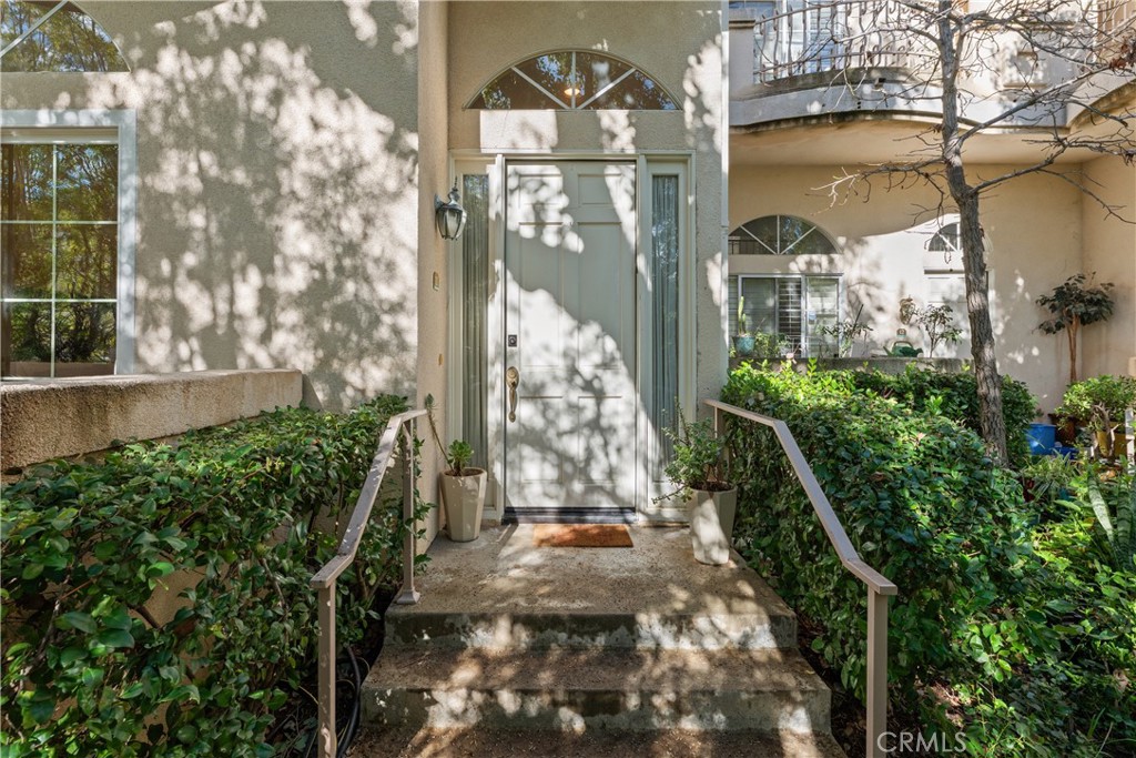 5340 Las Virgenes Road, Unit 11 Calabasas, CA 91302 - Photo 32 of 46 a view of entrance gate of a house