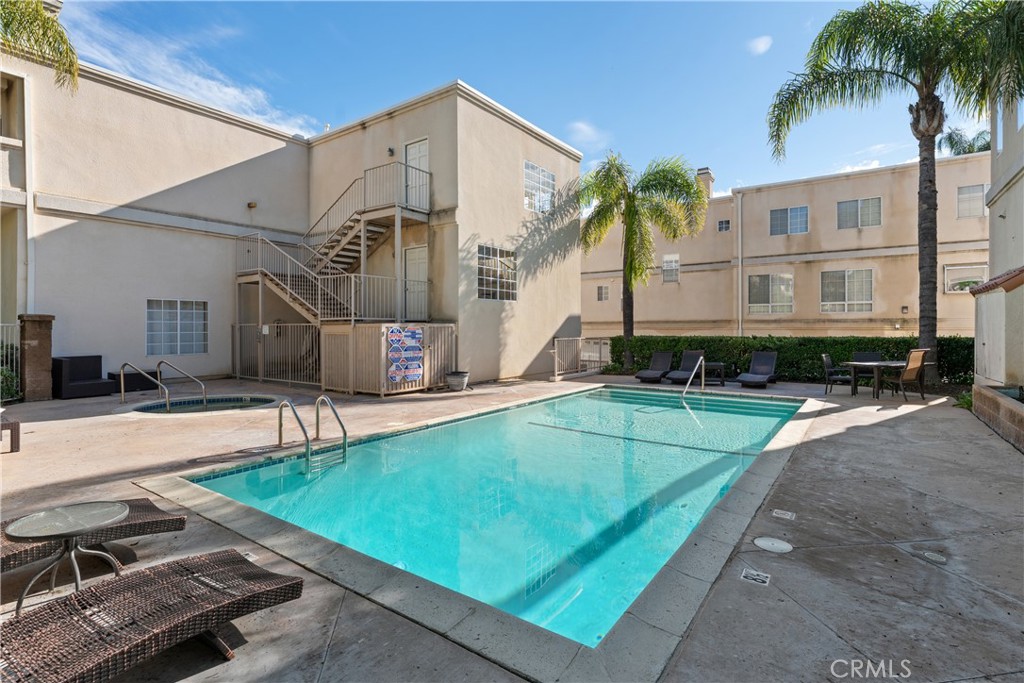5340 Las Virgenes Road, Unit 11 Calabasas, CA 91302 - Photo 35 of 46 a building with swimming pool in front of it
