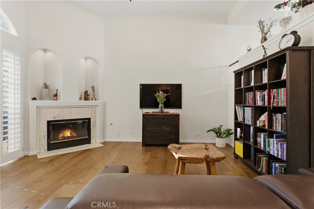 5340 Las Virgenes Road, Unit 11 Calabasas, CA 91302 - Photo 4 of 46 a living room with furniture and a fireplace