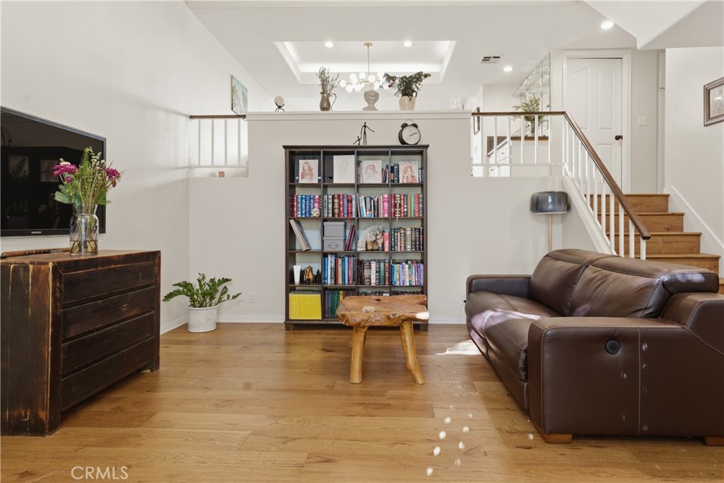 5340 Las Virgenes Road, Unit 11 Calabasas, CA 91302 - Photo 6 of 46 a living room with furniture and wooden floor