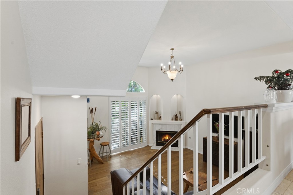 5340 Las Virgenes Road, Unit 11 Calabasas, CA 91302 - Photo 7 of 46 a view of staircase with railing and a chandelier