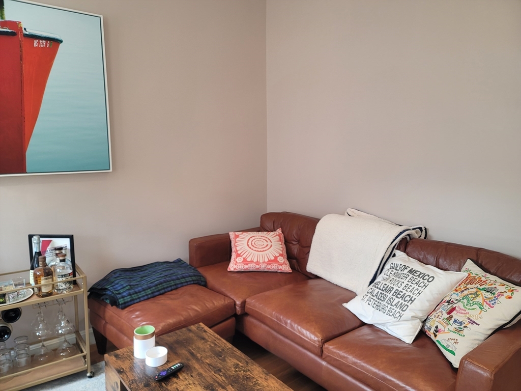 11 Phillips Street, Unit 8 Boston, MA 02114 - Photo 4 of 14 a living room with furniture and a couch