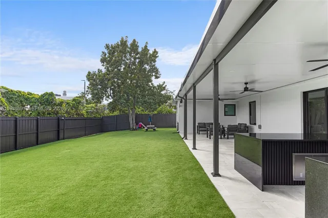 a kitchen with stainless steel appliances granite countertop a stove and a sink