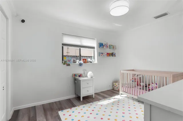 a bathroom with a granite countertop sink a toilet a mirror and shower