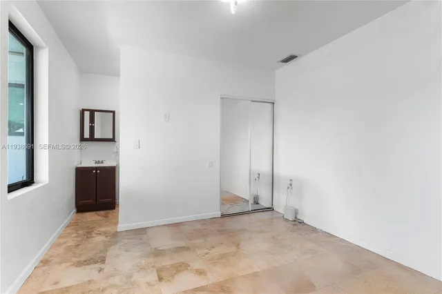 a view of a backyard with a garden and plants