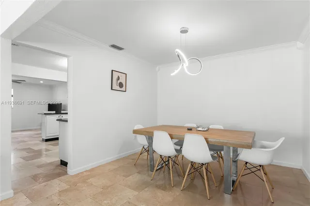 a view of a dining room with furniture