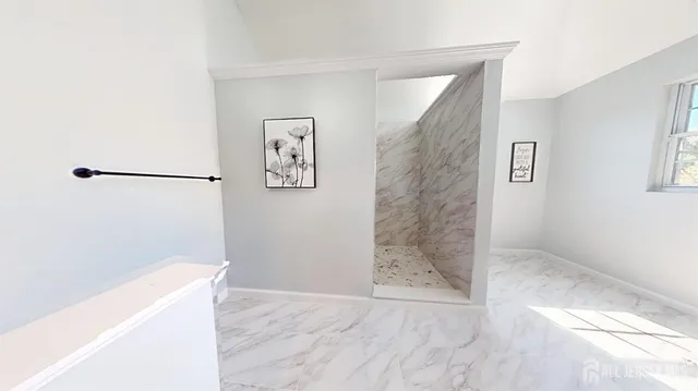 a bathroom with a toilet and shower