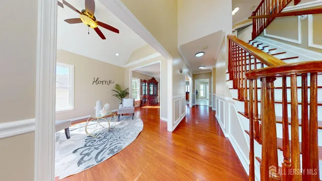a view of a livingroom with furniture window and wooden floor