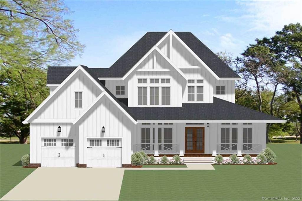 a front view of a house with yard and green space