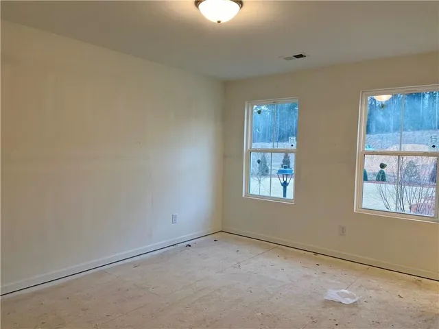 a view of an empty room and window