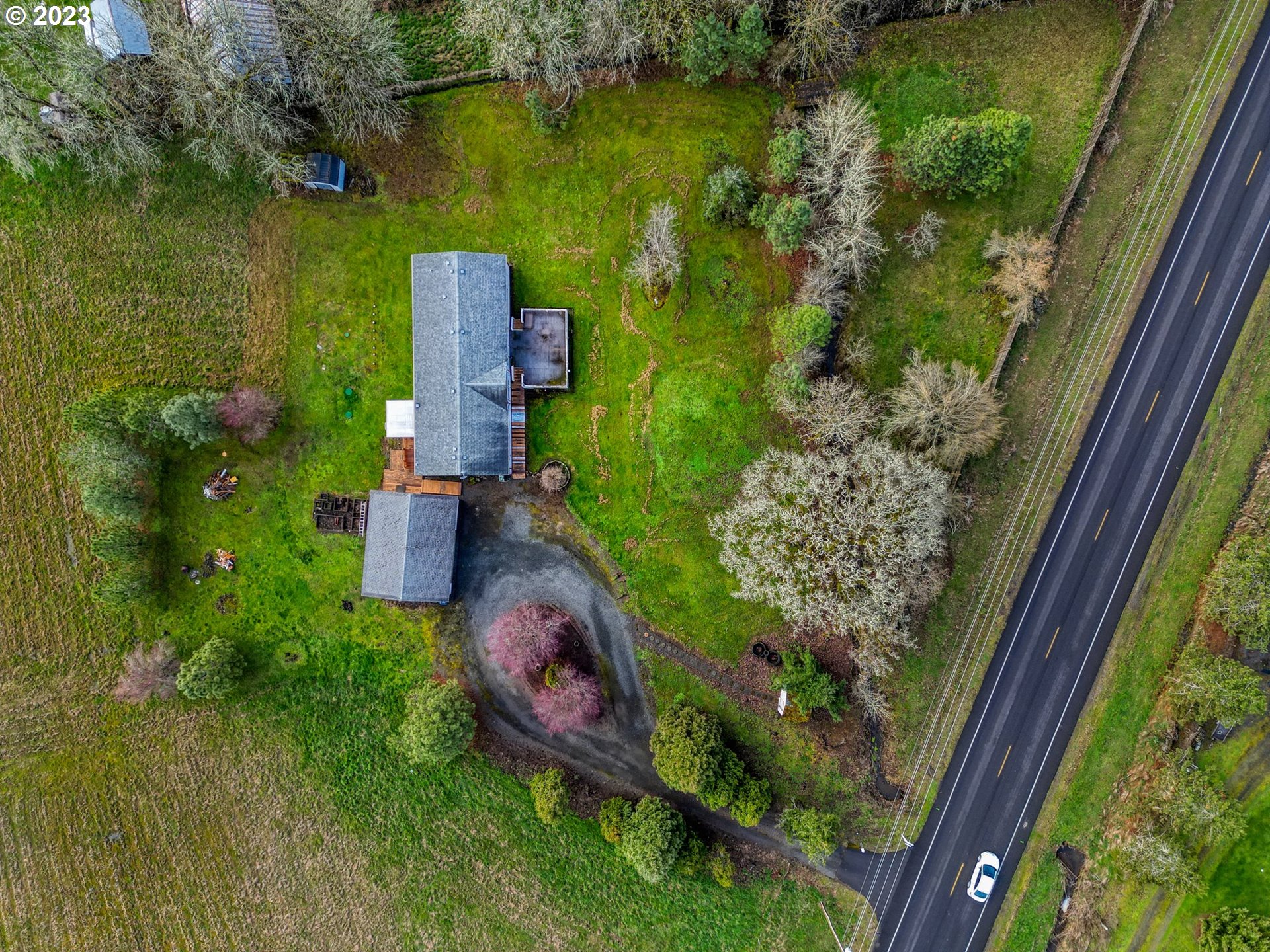 83373 Cloverdale Road Creswell, OR 97426 - Photo 28 of 28 an aerial view of a house with a garden and lake view