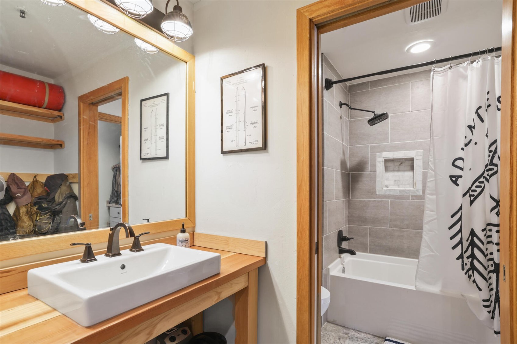 22174 Highway 6, Unit 1527 Keystone, CO 80435 - Photo 14 of 27 a bathroom with a sink mirror and a bathtub