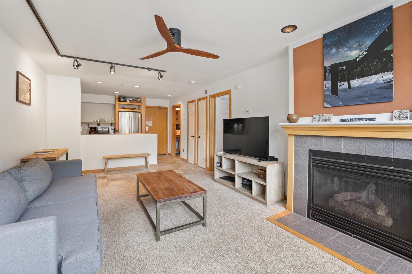 22174 Highway 6, Unit 1527 Keystone, CO 80435 - Photo 6 of 27 a living room with furniture and a flat screen tv